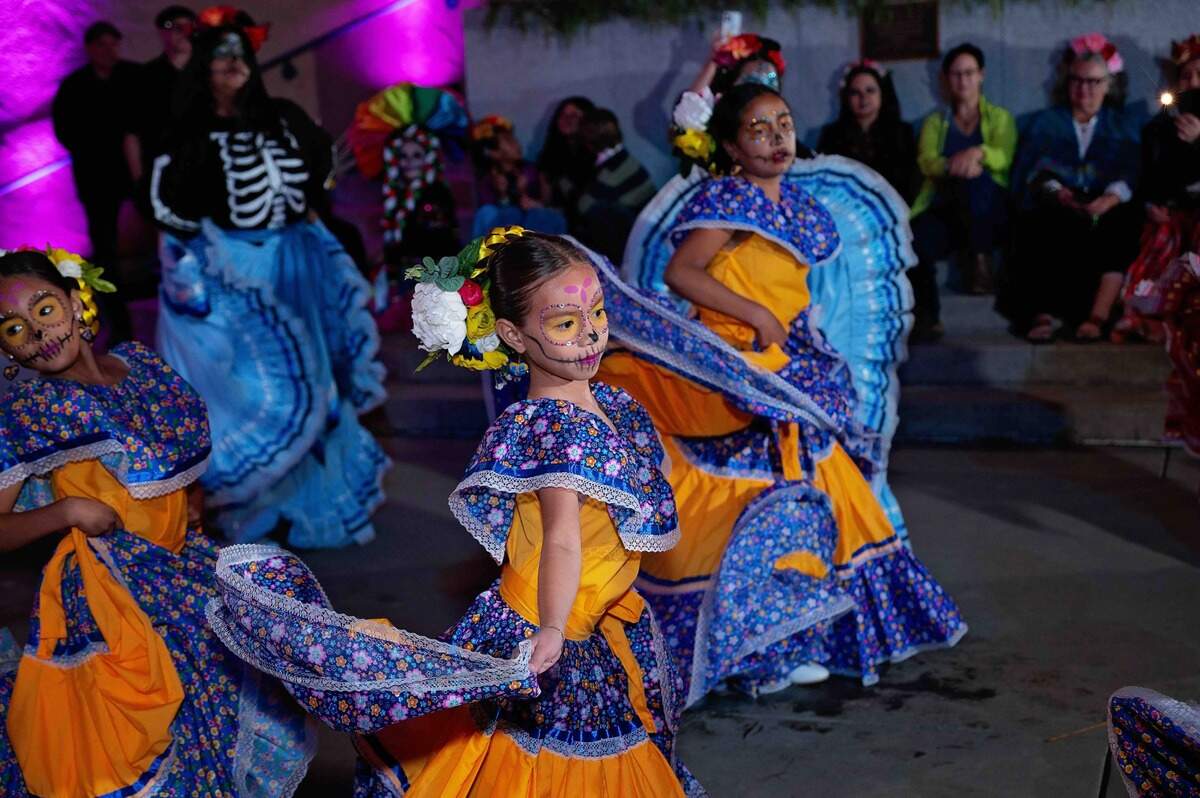 Las Hijas de Maria performs to a lively crowd at the California Museum’s 2025 Día de los Muertos Fiesta.
